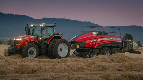 Massey Ferguson 2370 UHD baler with tractor with hills in background
