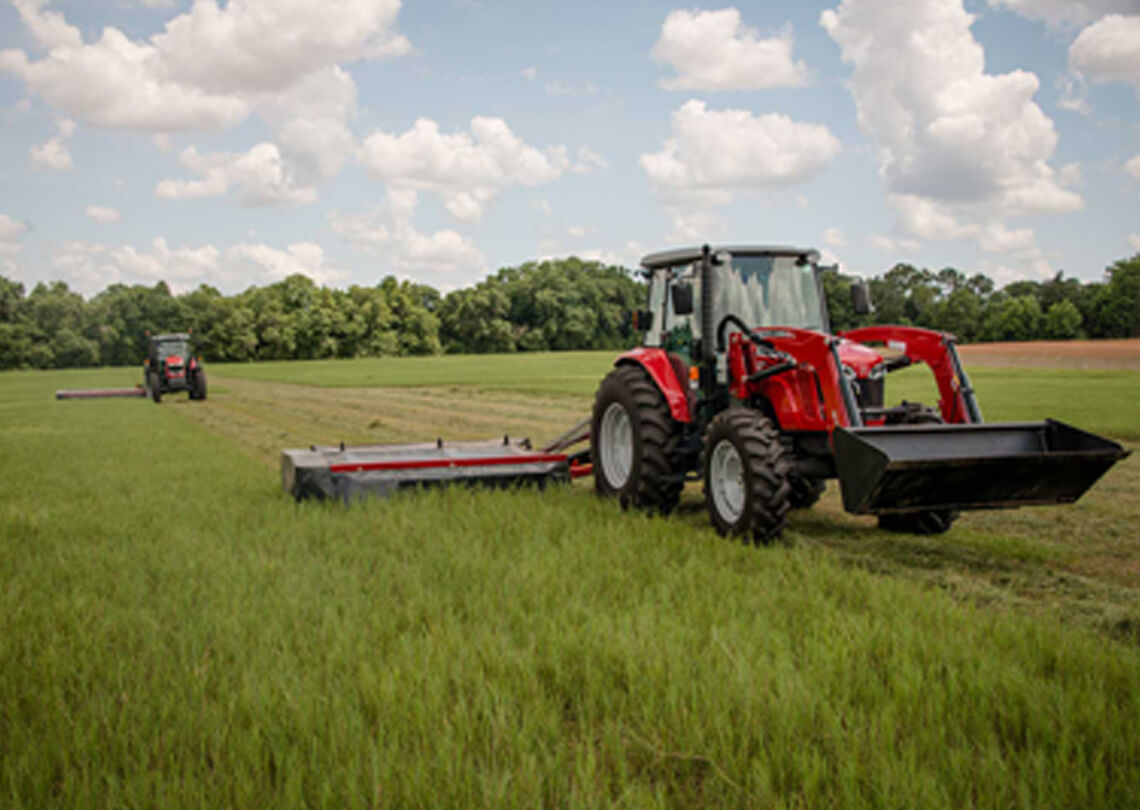Massey Ferguson Pro series disc mower with tractor in field