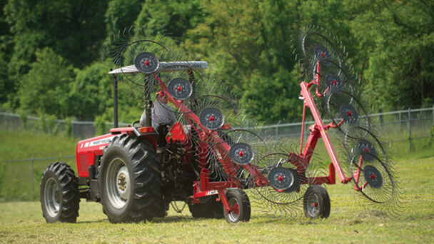 Massey Ferguson 1500 vertical fold rake with tractor in field
