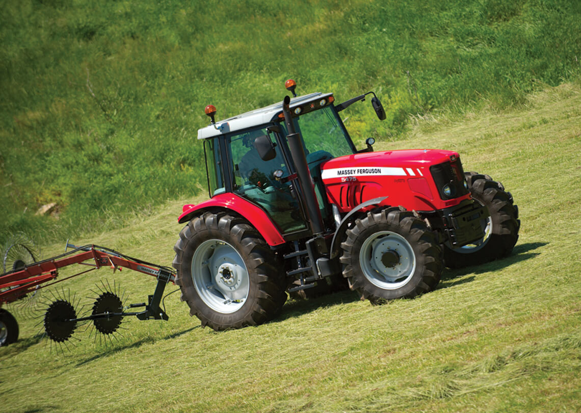 Massey Ferguson 3900 wheel rake with tractor side view
