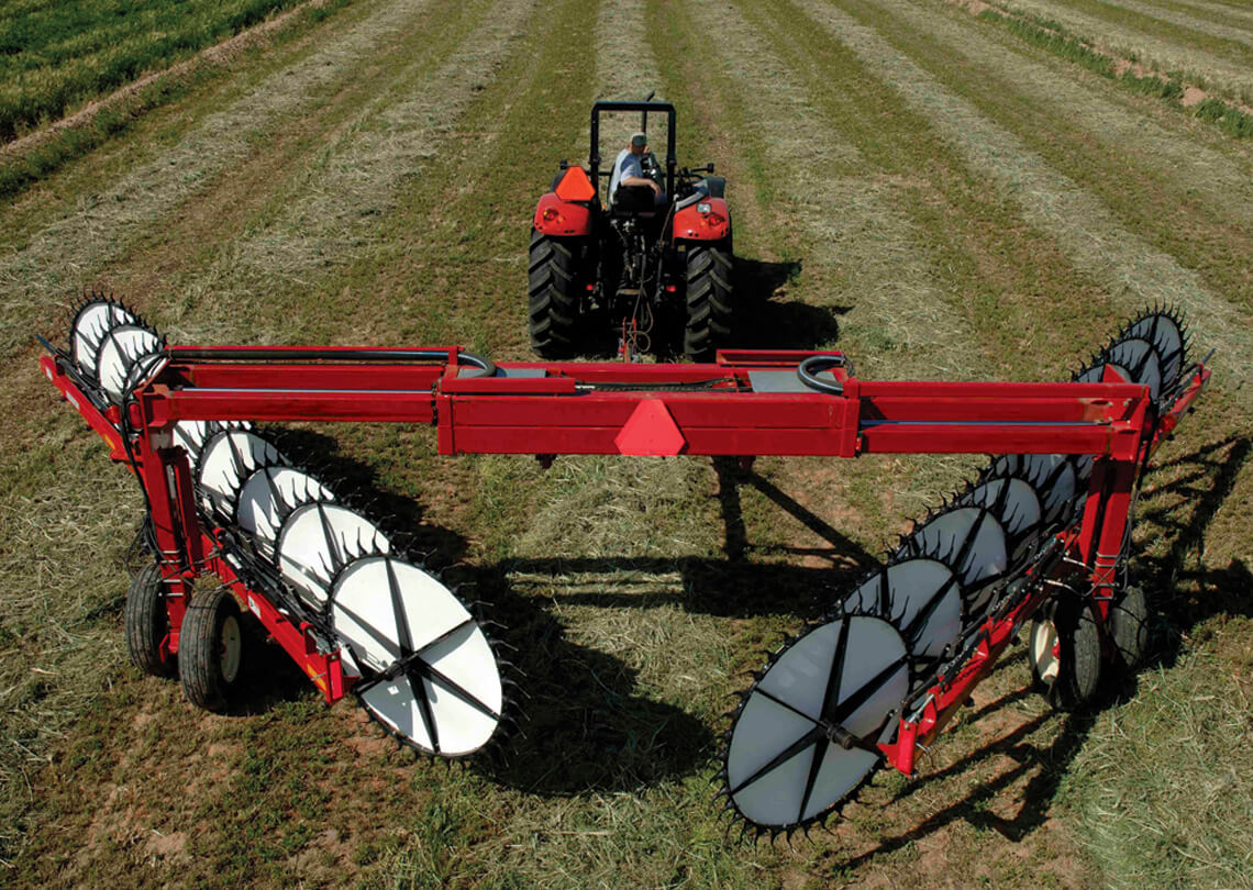 Massey Ferguson 5130 wheel rake in field