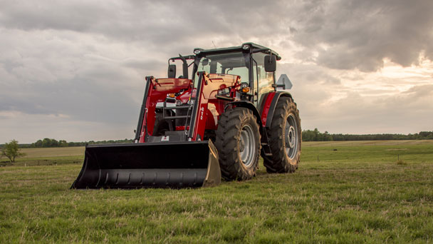Massey Ferguson 6700 tractor with front loader with cloudy sky