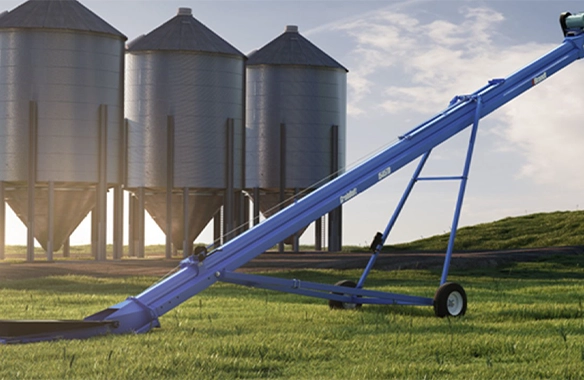 Brandt conveyor system with high throughput and gentle grain handling, positioned near elevated silos.