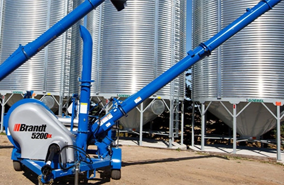 Brandt 5200 EX GrainVac with heavy-duty construction, designed for fast grain transfer near storage silos.