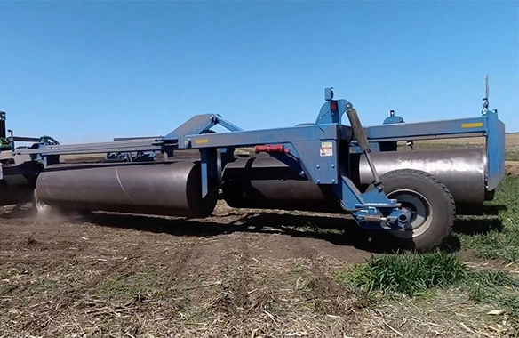 Brandt land roller with reinforced frame and heavy-duty rollers, providing superior soil compaction and rock management.