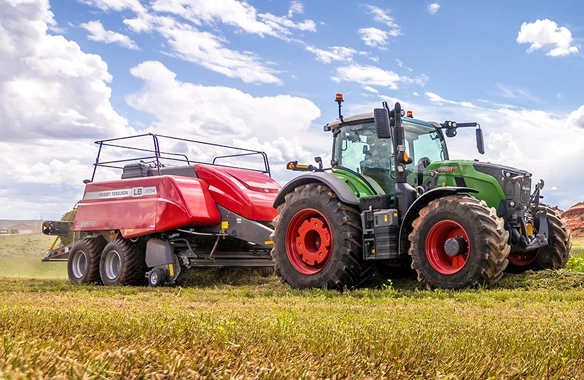 Fendt 700 Vario tractor paired with a Massey Ferguson LB2200 baler working in the field—representing AGCO's advanced hay and forage solutions among leading agricultural equipment brands.